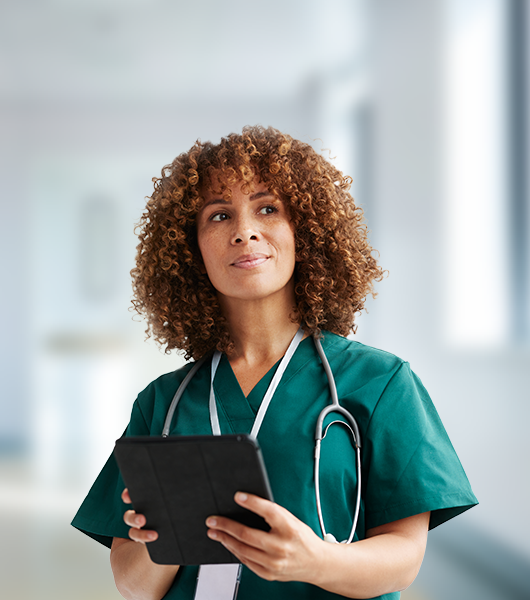 A nurse holding a tablet. 