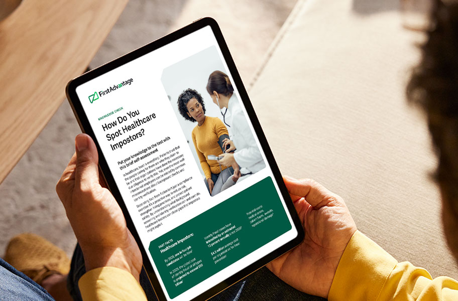 Medical personnel looking at a laptop.