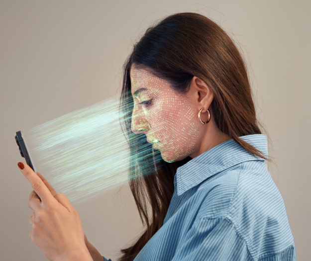 https://4830052.fs1.hubspotusercontent-na1.net/hubfs/4830052/PM%20(Product%20Marketing)/Images/Brunette%20woman%20scanning%20face%20with%20phone-GettyImages-1492635167.jpg